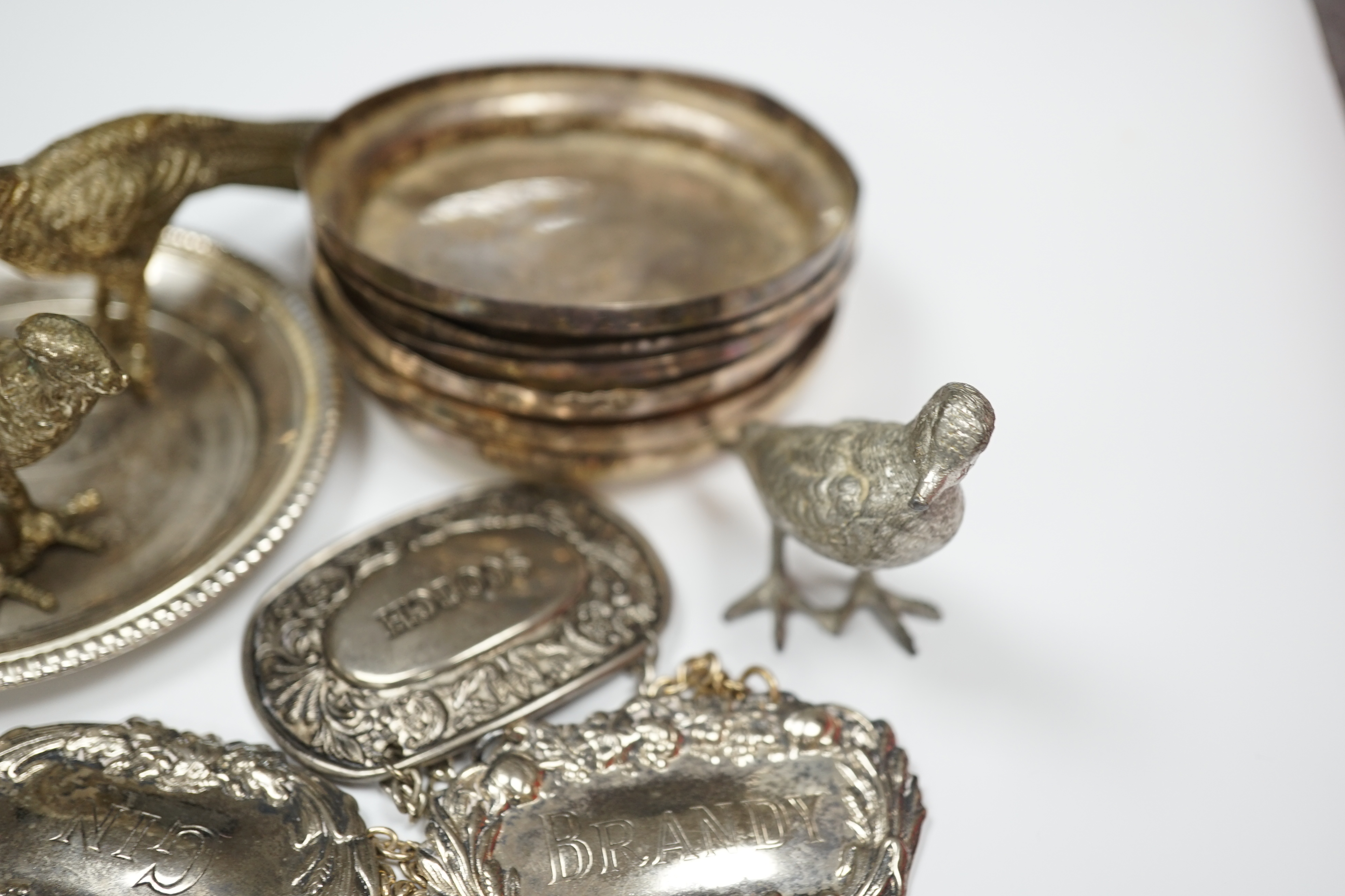 Mixed silver plate including cutlery, dishes, decanter labels and model pheasants